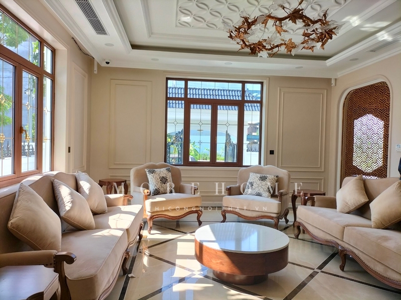 Thi công bộ sofa khung gỗ óc chó bọc nỉ màu be tân cổ điển vẻ đẹp sang trọng, quyền quý, đón tiếp khách chu đáo, thẩm mỹ cao cho không gian